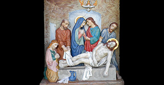 Der heilige Leichnam Jesu wird in das Grab gelegt